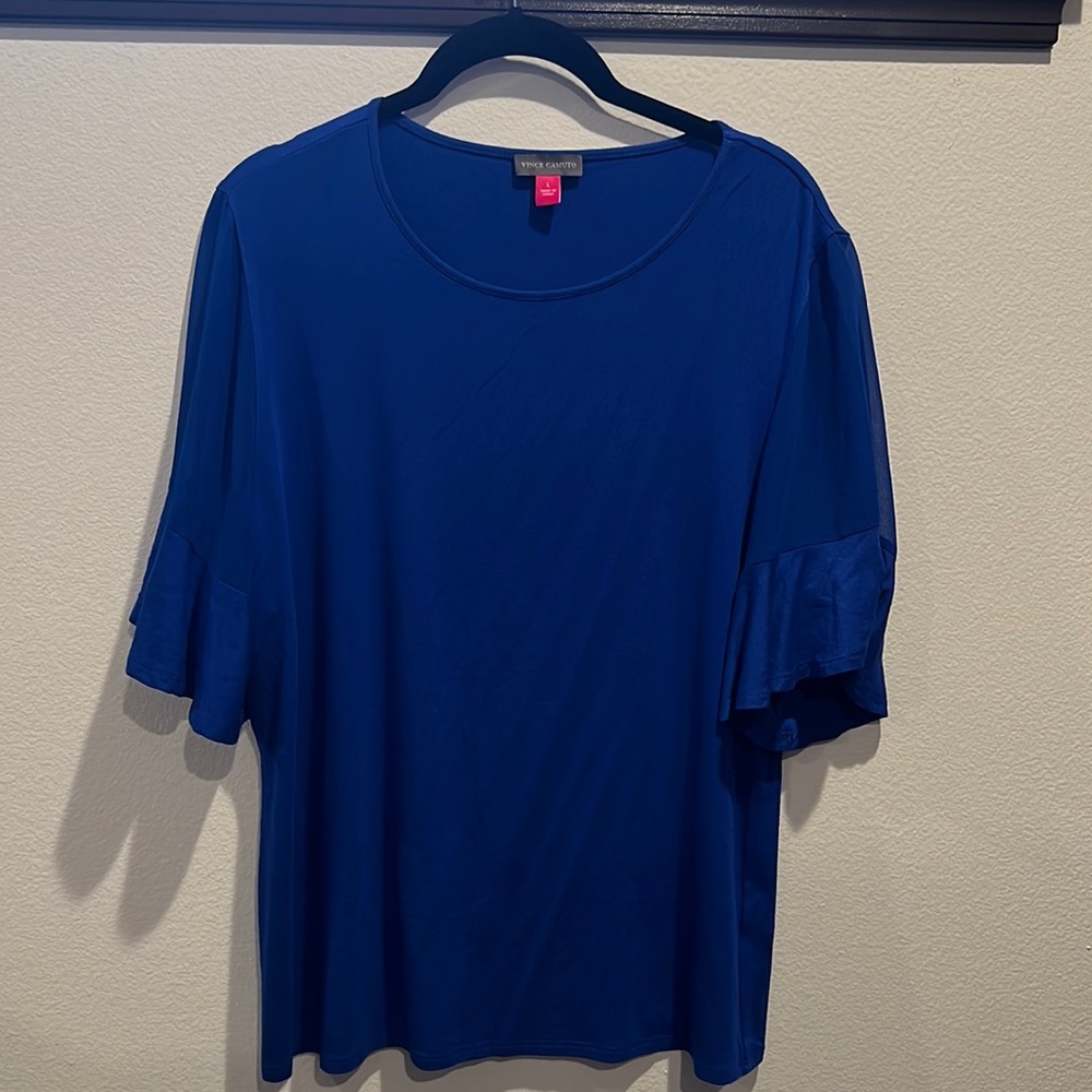 Vince Camuto top. Body soft knit tee shirt material. Sleeve sheer. Solid ruffle